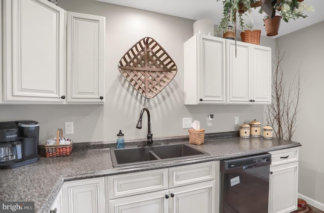 kitchen featuring sink, dishwasher, and white cabinetry