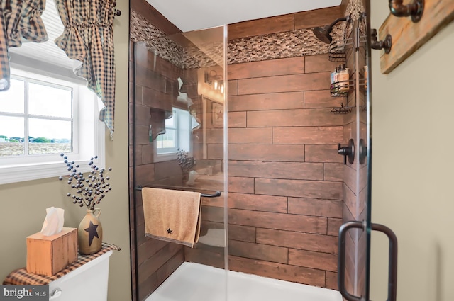 bathroom with a wealth of natural light and walk in shower