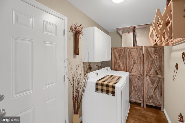 laundry area with cabinets and hardwood / wood-style floors