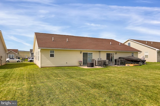 back of property featuring a patio and a yard