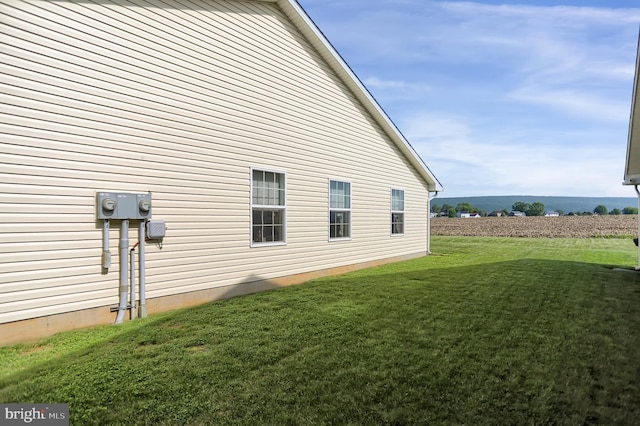 view of home's exterior featuring a lawn