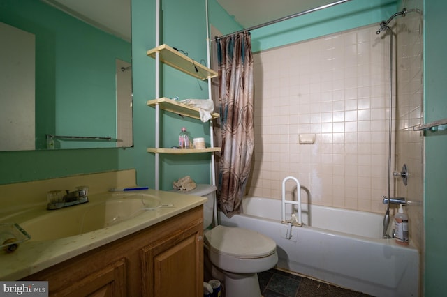 full bathroom with vanity, shower / tub combo, and toilet