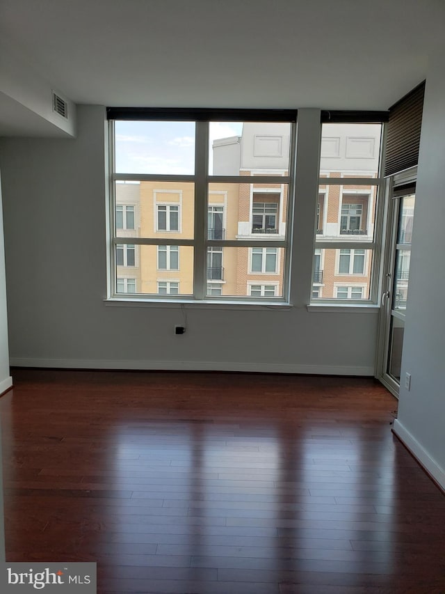 unfurnished room featuring dark hardwood / wood-style floors