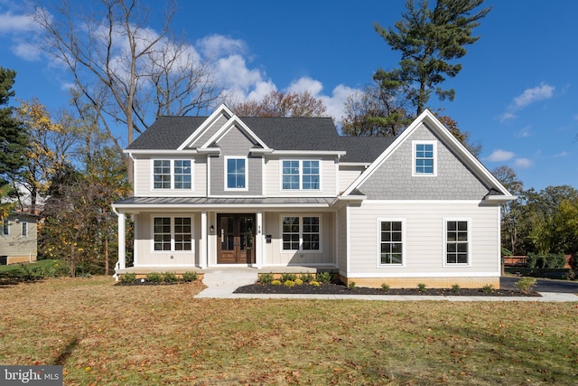 view of front of home with a front lawn and a porch