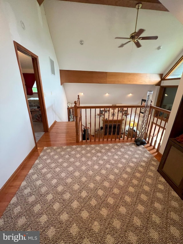 interior space featuring hardwood / wood-style floors and high vaulted ceiling