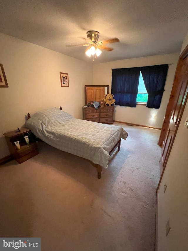 carpeted bedroom featuring ceiling fan and pool table