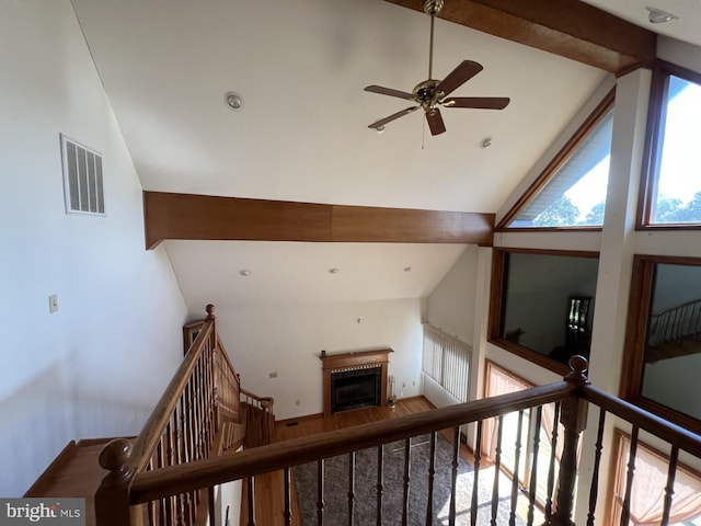 hallway featuring hardwood / wood-style floors and high vaulted ceiling