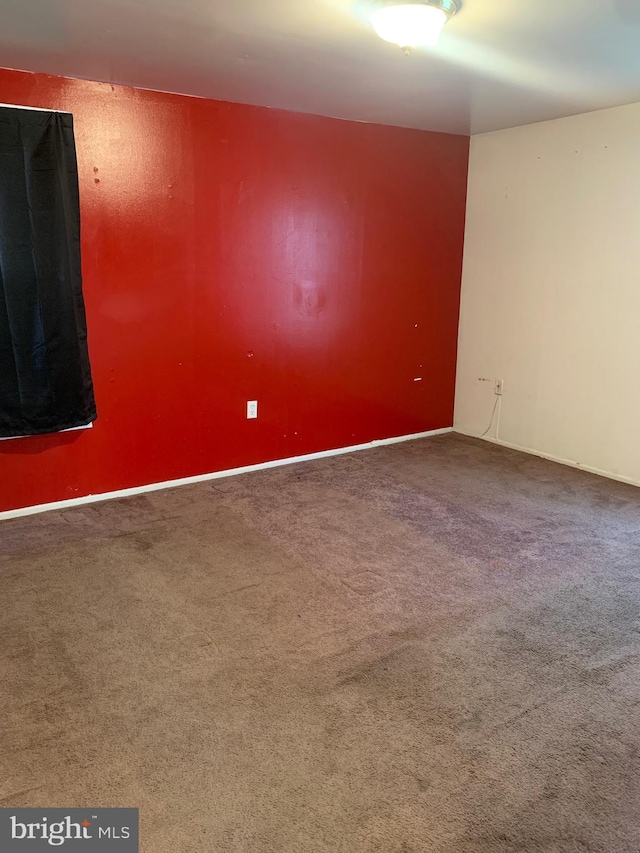 spare room featuring carpet flooring