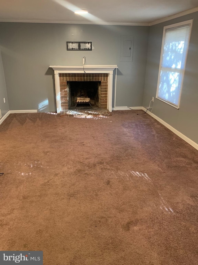 unfurnished living room with crown molding, a fireplace, and carpet