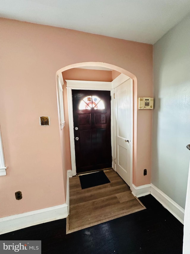 foyer entrance featuring dark hardwood / wood-style flooring