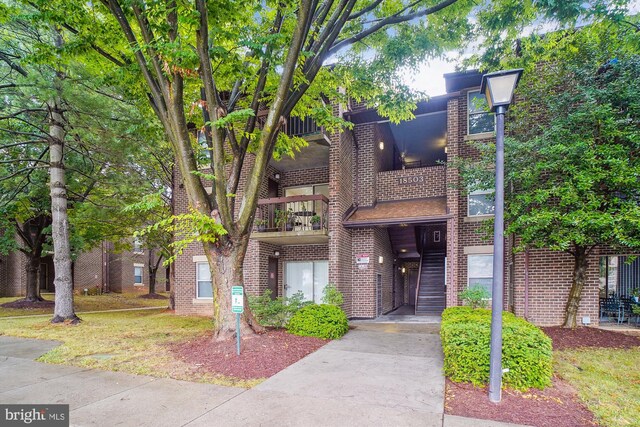 18503 Sweet Autumn Dr Unit 201, Gaithersburg, MD 20879 - view of building exterior featuring uncovered parking