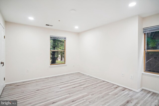 18503 Sweet Autumn Dr Unit 201, Gaithersburg, MD 20879 - unfurnished bedroom with multiple closets, light wood-type flooring, recessed lighting, and baseboards