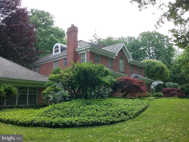 exterior space with a front lawn