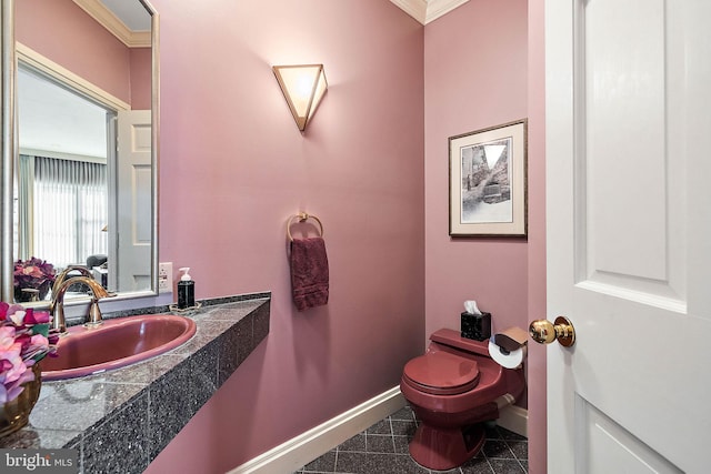 bathroom with crown molding, tile flooring, vanity, and toilet