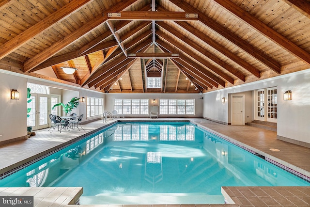 view of swimming pool featuring french doors