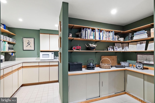 interior space featuring light tile floors