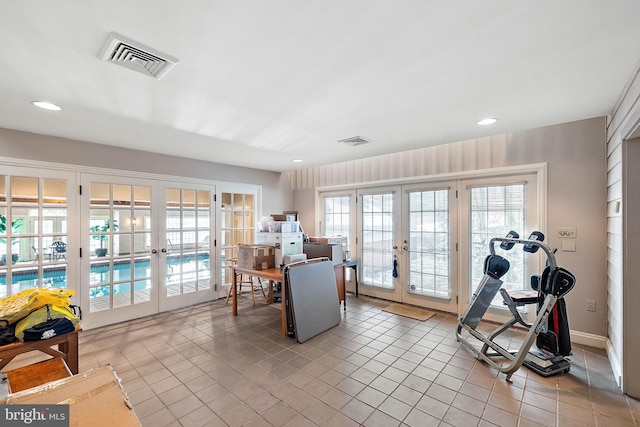 interior space featuring french doors and light tile floors