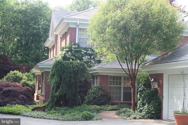 obstructed view of property featuring a garage