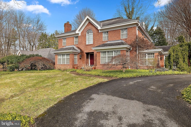 view of property featuring a front yard