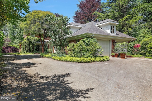 view of side of home with a garage