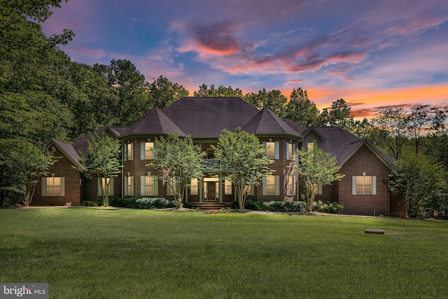 view of front of house with a yard