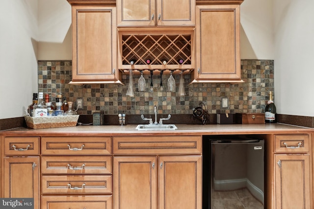 kitchen with backsplash, dishwasher, fridge, tile flooring, and sink