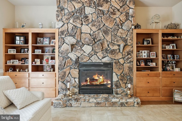 living room featuring tile flooring and a fireplace