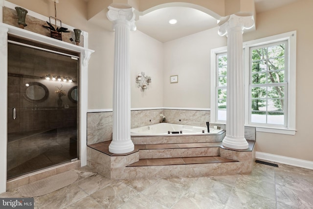 bathroom with a healthy amount of sunlight, ornate columns, plus walk in shower, and tile floors