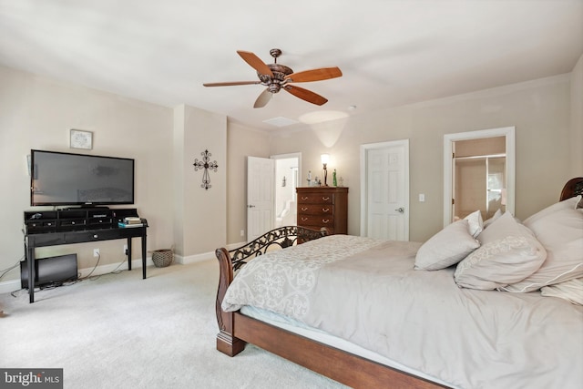 bedroom with ceiling fan, a closet, and light colored carpet