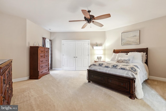 carpeted bedroom featuring a closet and ceiling fan