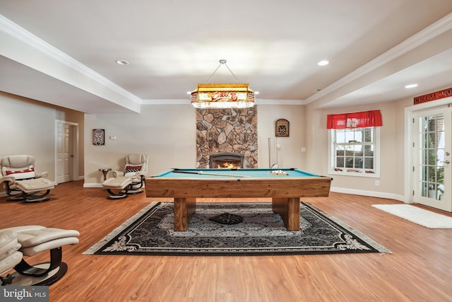 recreation room with crown molding, a fireplace, pool table, and hardwood / wood-style flooring