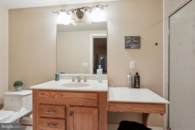 bathroom with toilet and vanity