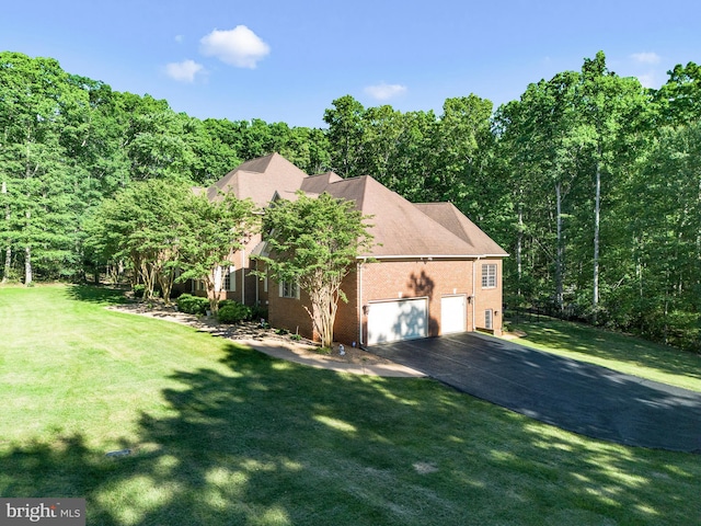 exterior space with a garage and a yard