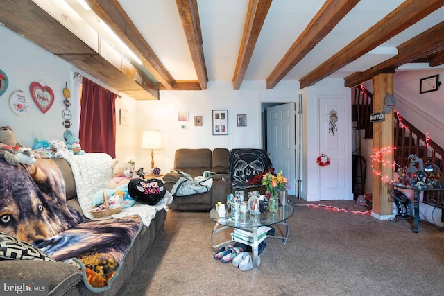 carpeted living room featuring beamed ceiling