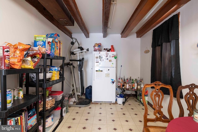 interior space with white fridge and tile floors