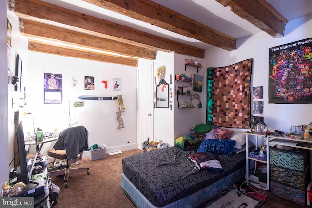 carpeted bedroom with beamed ceiling