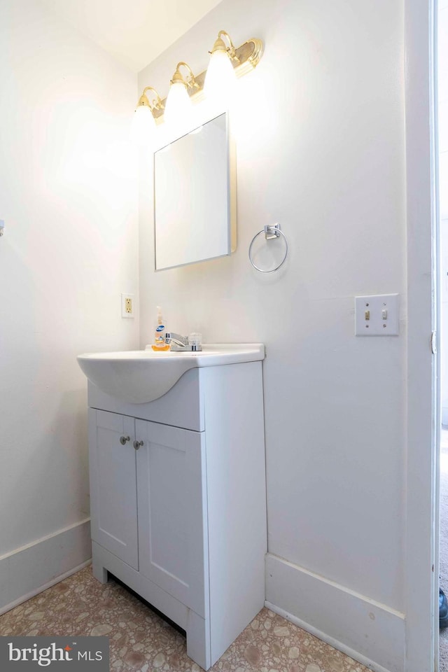 bathroom featuring tile floors and vanity