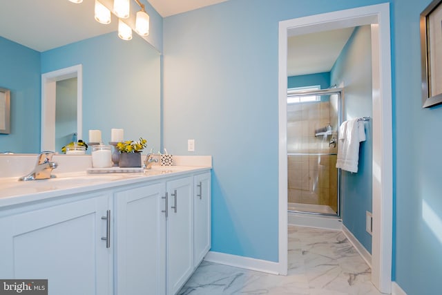 bathroom featuring dual sinks, tile flooring, a shower with shower door, and oversized vanity