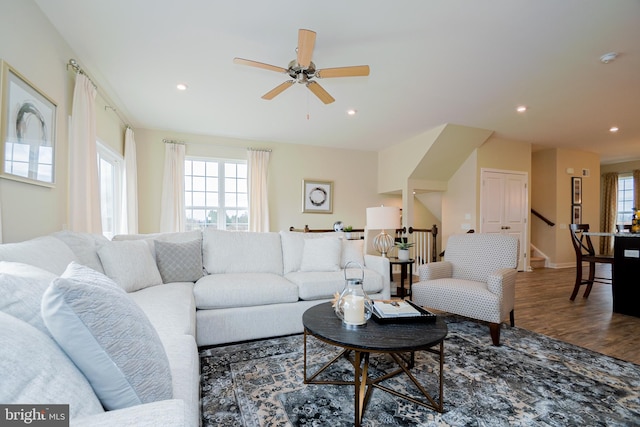 living room featuring hardwood / wood-style flooring and ceiling fan