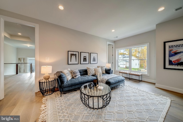 living room with light hardwood / wood-style flooring