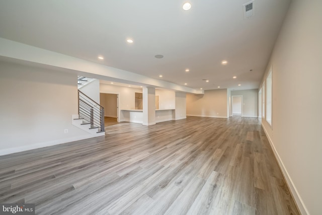 unfurnished living room with light hardwood / wood-style floors