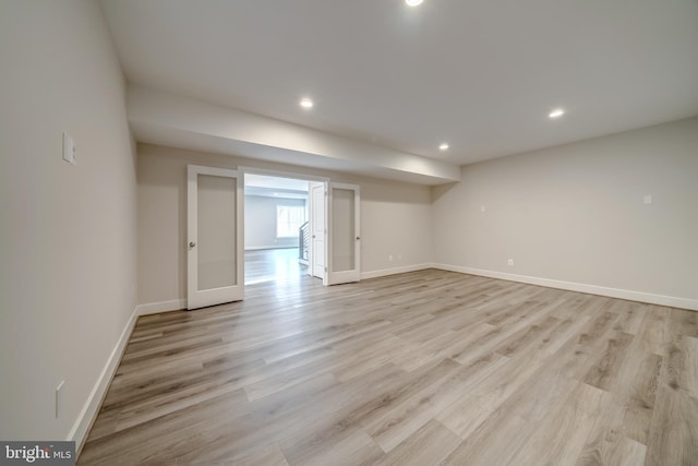 unfurnished room with light hardwood / wood-style flooring