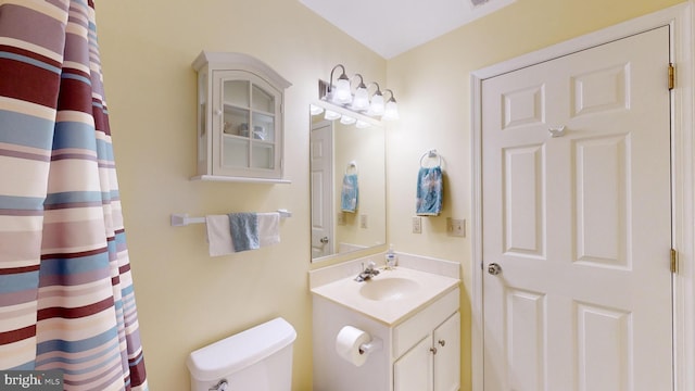 bathroom with vanity and toilet