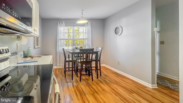 dining area with light wood-type flooring