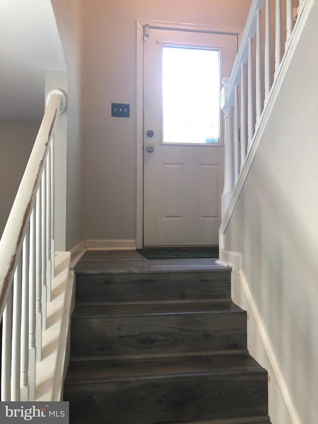 staircase featuring hardwood / wood-style floors