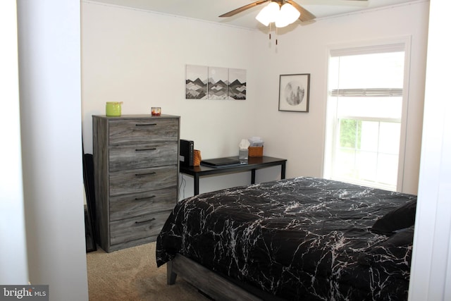 bedroom with ceiling fan and carpet floors