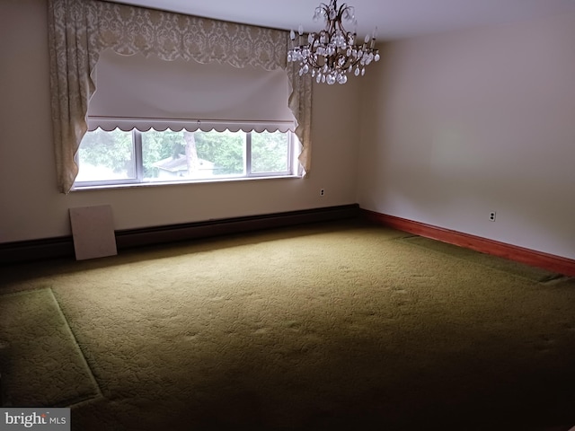 spare room with a chandelier, carpet flooring, and baseboard heating