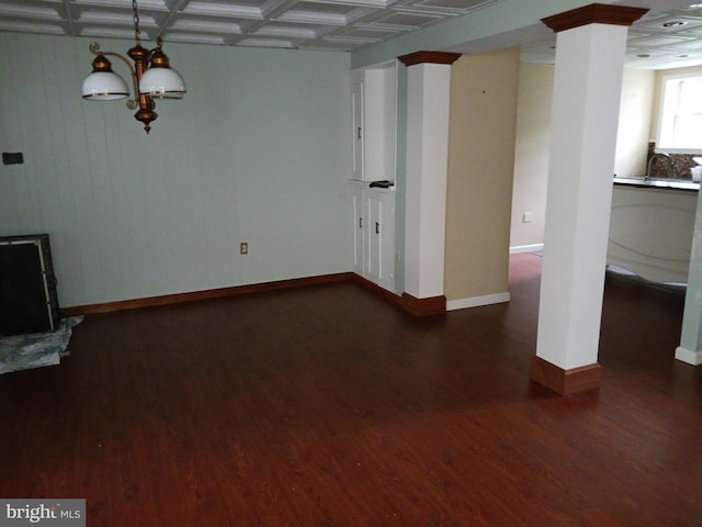 unfurnished living room featuring beamed ceiling, dark hardwood / wood-style floors, and coffered ceiling