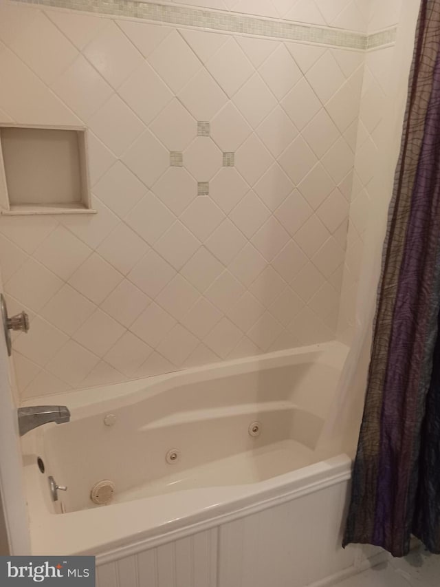 bathroom featuring shower / bath combination with curtain