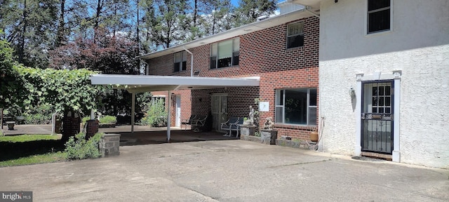 exterior space with a carport